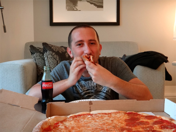 Chowing Down on A Gigantic Pizza with a Coke Chowing Down on A Gigantic Pizza with a Coke