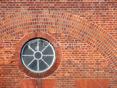 ist2_7296059-large-round-victorian-window-in-brick-wall