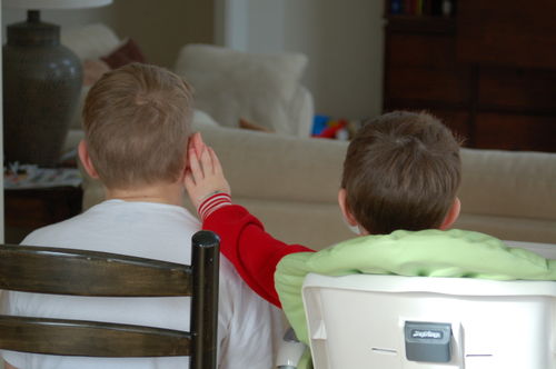 Toddler Child touching Oldest Boy's ear - 2.21.09