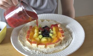 Pouring the rasberry sauce